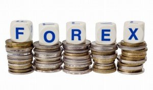 Stacks of coins with the word FOREX isolated on white